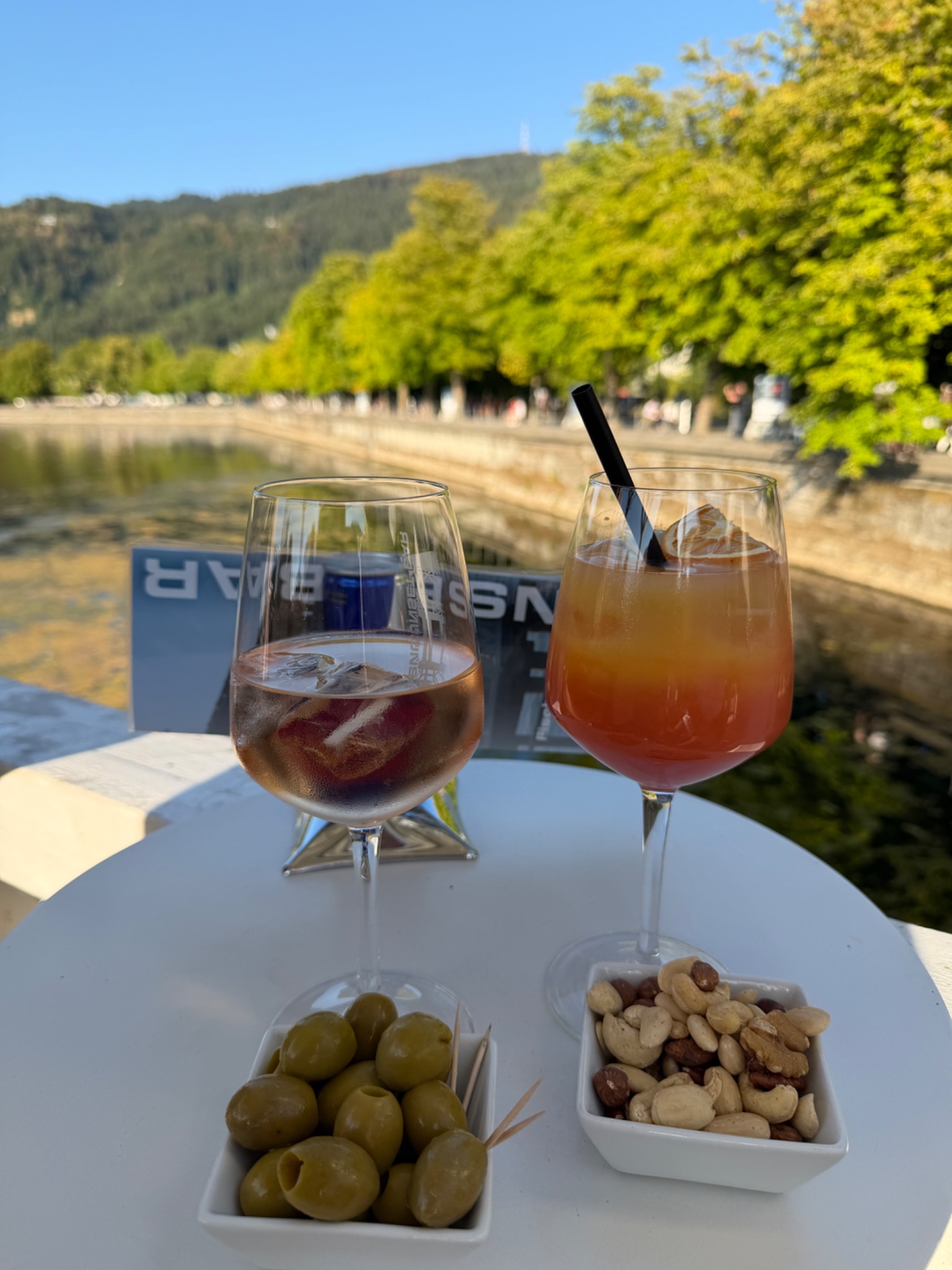 Aperitif drinks, olives and nuts beside Lake Constance at Fischersteg